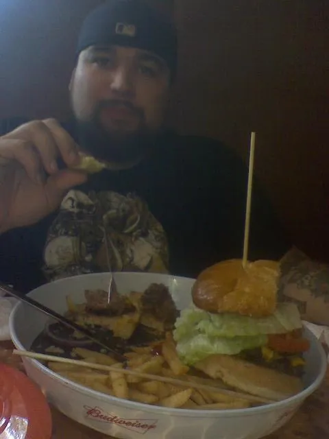 This is the face of a man who has been beaten and stuffed to the gills.